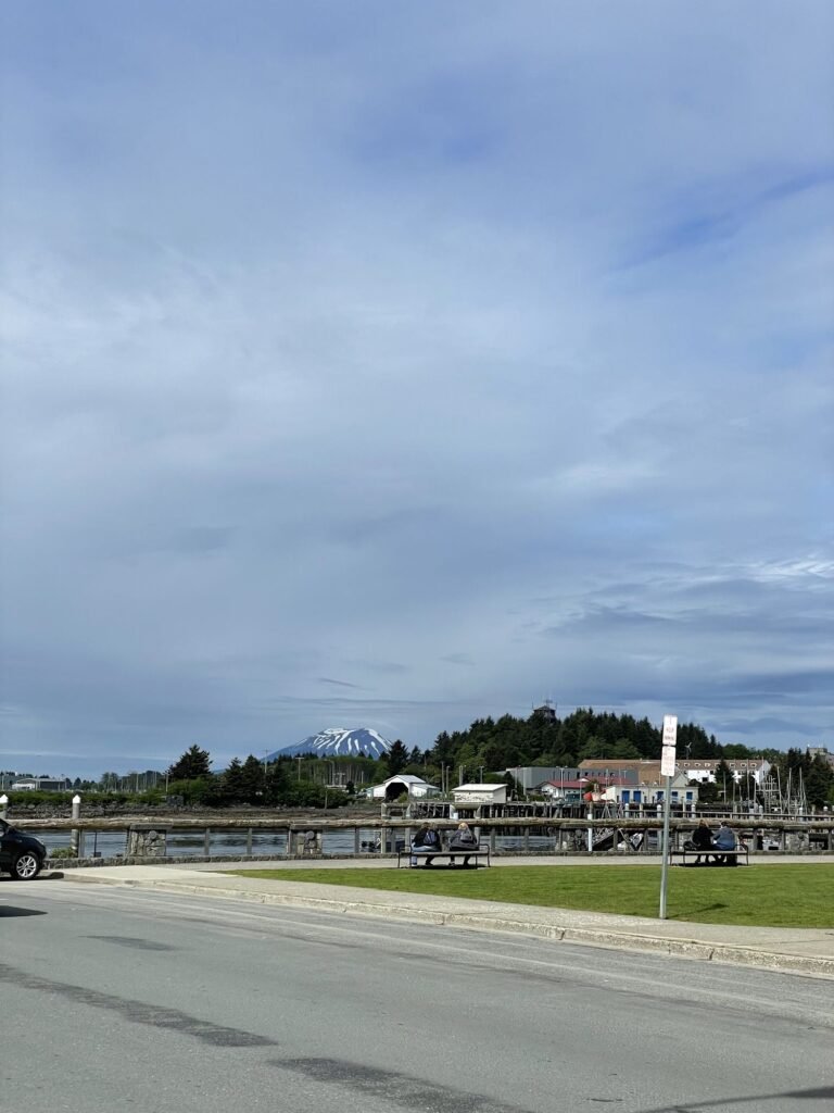 A quiet main street in Sitka, Alaska, with the harbor beyond