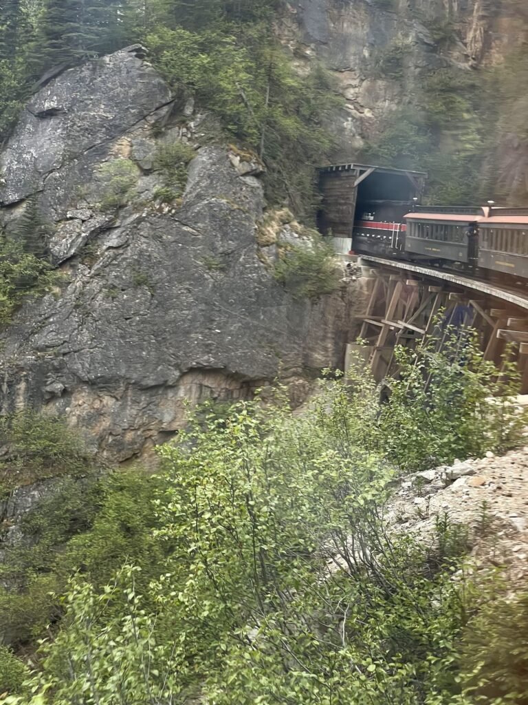 White Pass train entering a mountain tunnel on the way to British Columbia